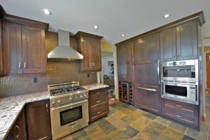 After photo of the same kitchen, but with totally new custom cabinets throughout. Just goes to show what a huge difference some new, high-quality custom cabinetry can make!