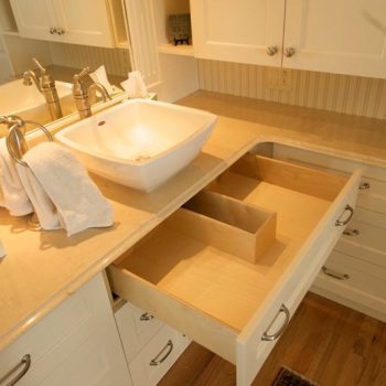 We made these drawers for a client who really needed some better bathroom storage solutions. We also customized this specialty drawer to fit around the sink's drainage pipe.