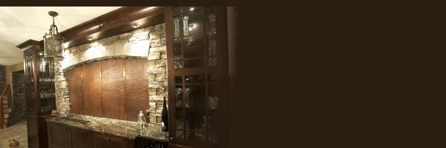 Wood and brick custom bar cabinet in a basement recreational room.